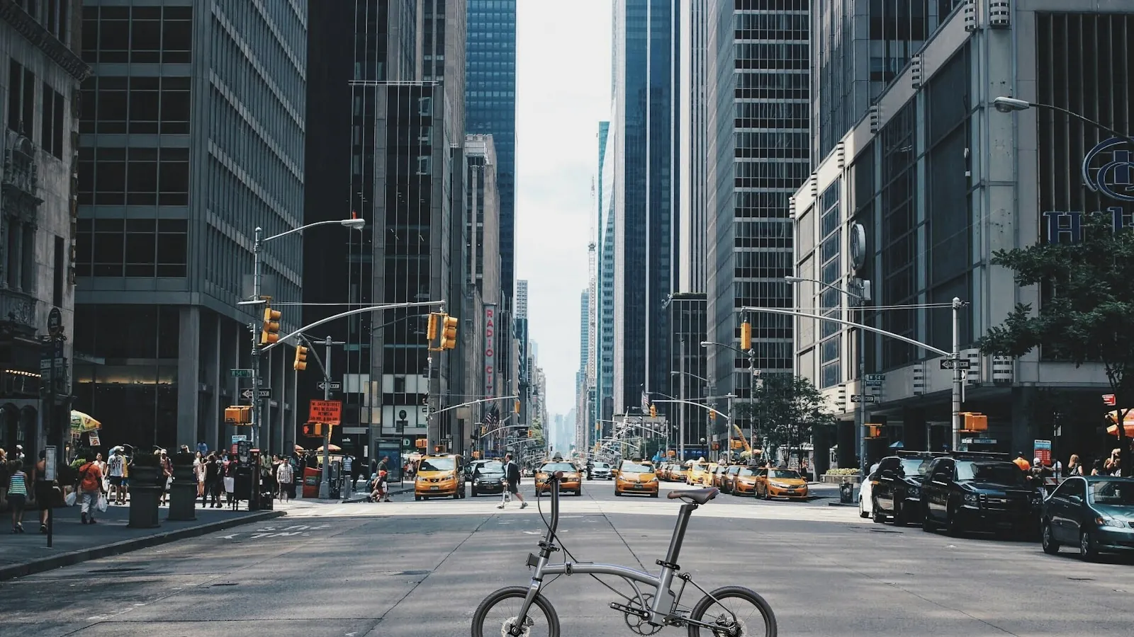 Folding ebike with mid-drive motor carried into metro – Bamboo Flute by Geektion