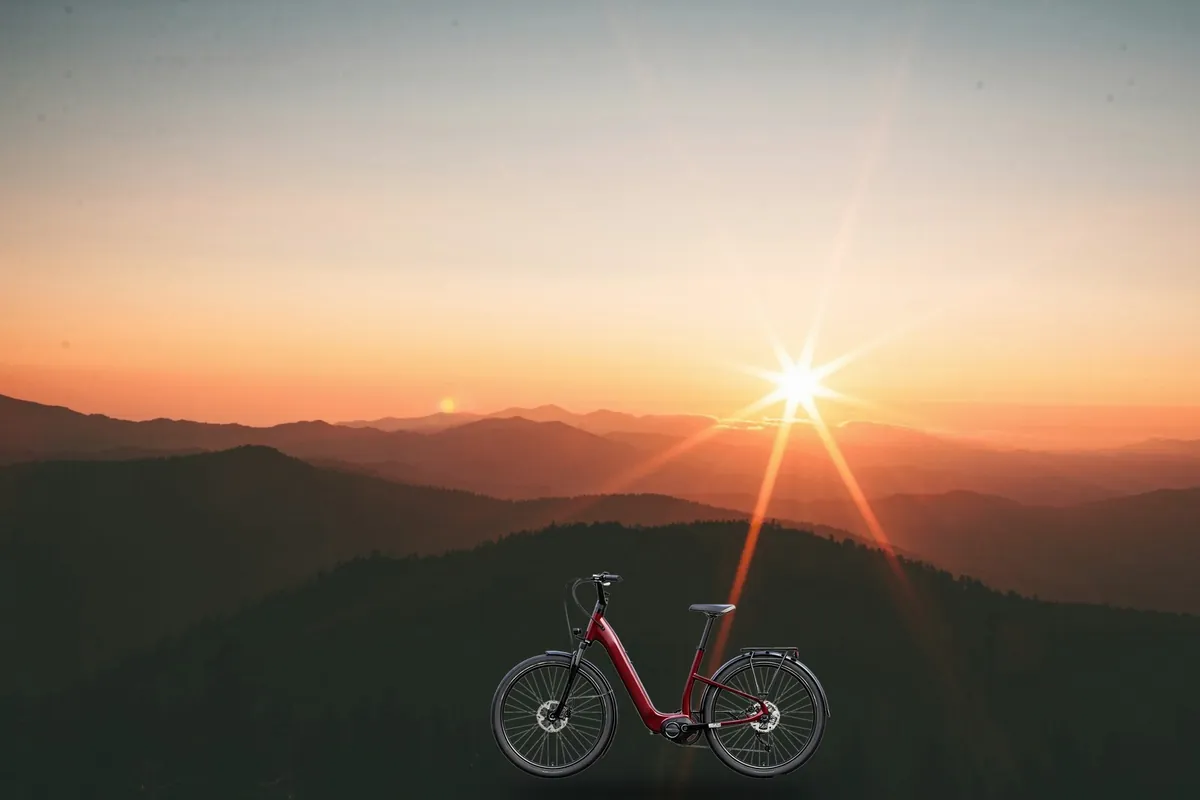 28 inch European city ebike at dusk – Meteor City L1 mid-drive ebike